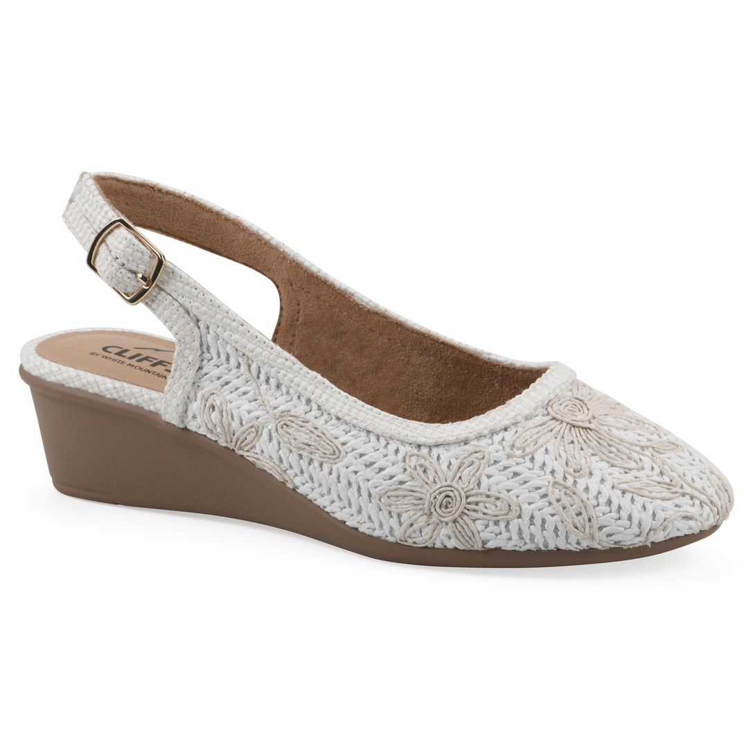 Angle view of a woven, white, raffia slingback with white floral detailing and an adjustable heel strap