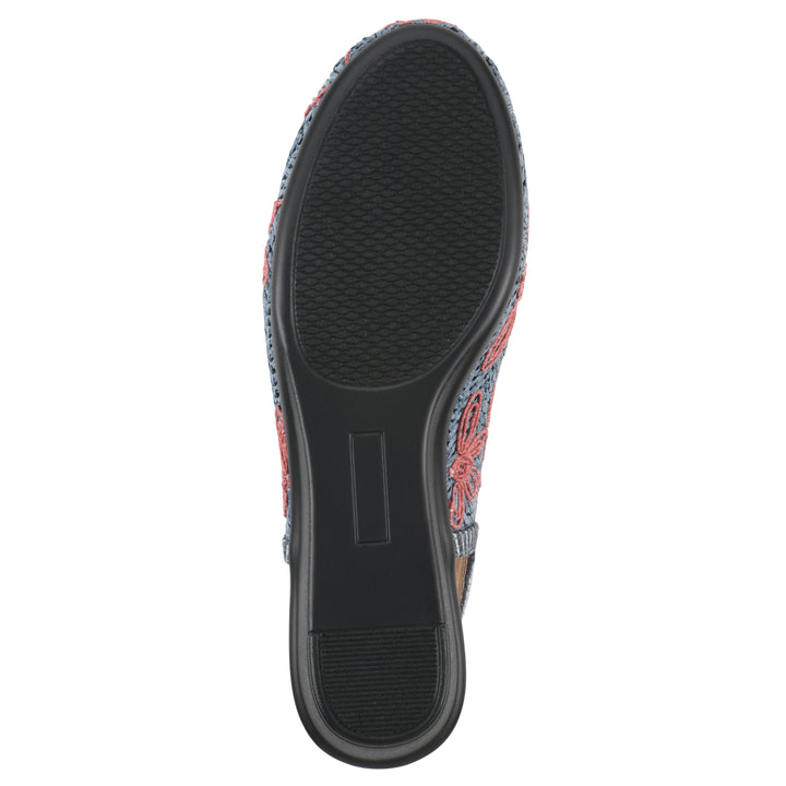 Sole view of a woven, blue, raffia slingback with muted red floral detailing and an adjustable heel strap