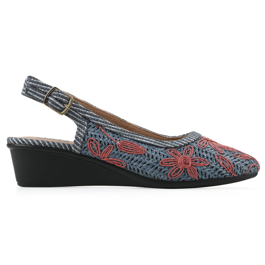Side view of a woven, blue, raffia slingback with muted red floral detailing and an adjustable heel strap