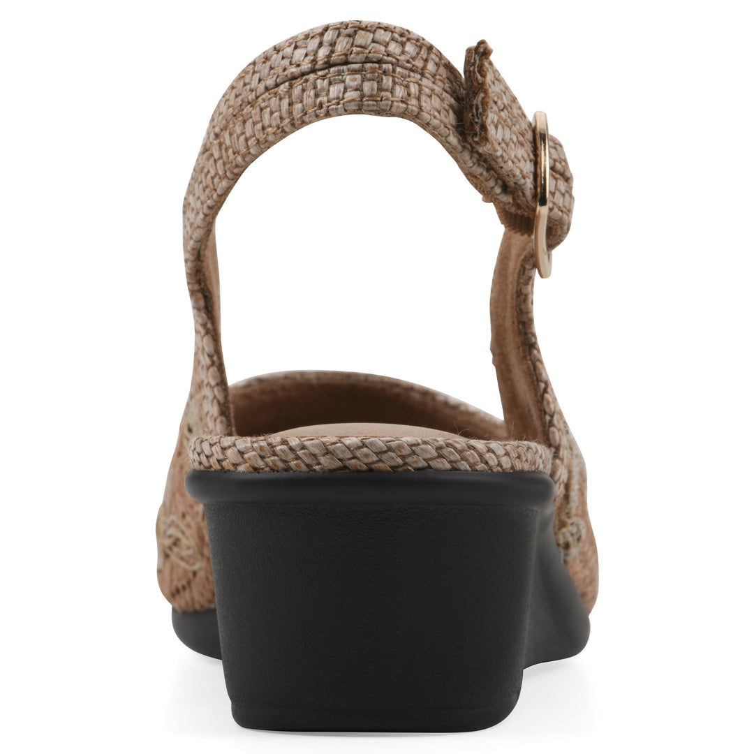 Rear view of a woven, cognac, raffia slingback with neutral floral detailing and an adjustable heel strap