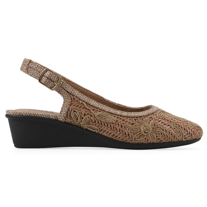 Side view of a woven, cognac, raffia slingback with neutral floral detailing and an adjustable heel strap