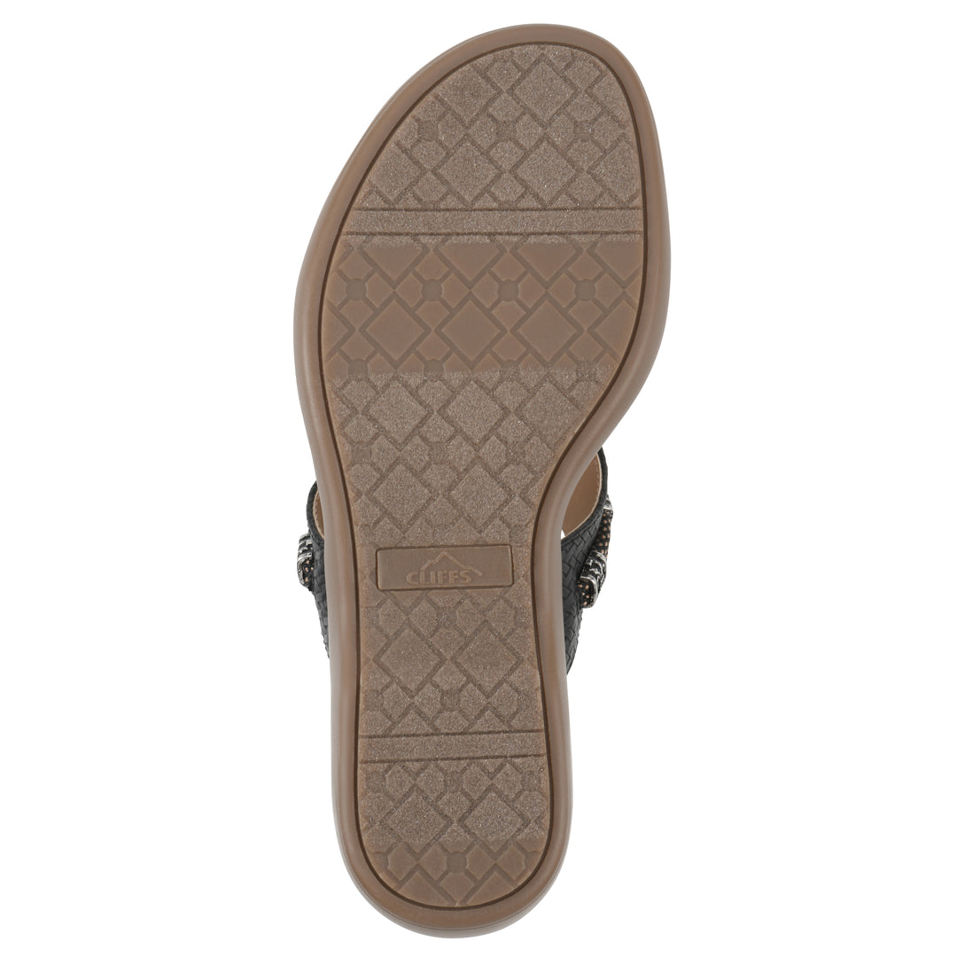 Sole view of black thong sandal with silver bead embellishments and a tan sole