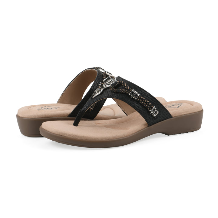 Angle view of a pair of black thong sandals with silver bead embellishments and a tan sole