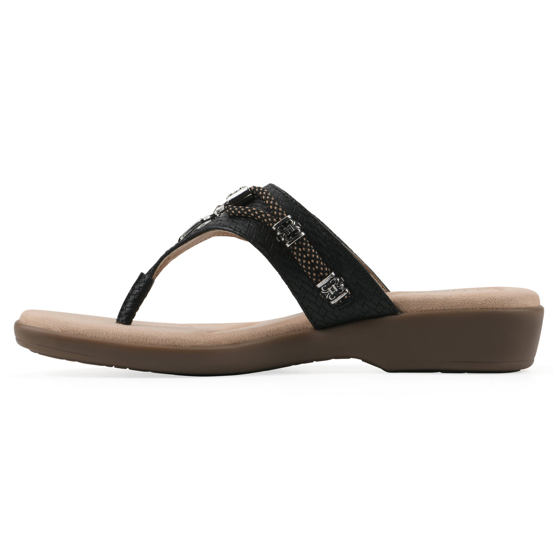 Side view of black thong sandal with silver bead embellishments and a tan sole