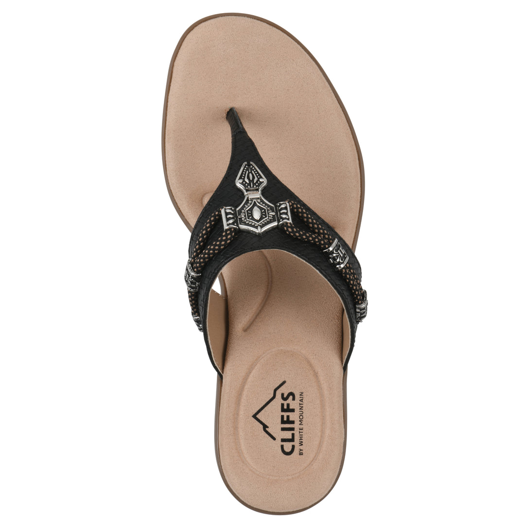 Top view of black thong sandal with silver bead embellishments and a tan sole