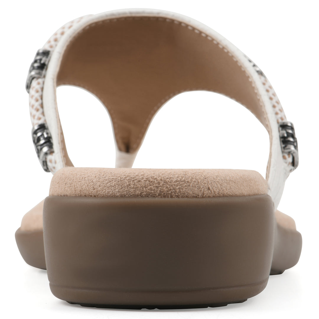 Rear view of white thong sandal with silver bead embellishments and a tan sole
