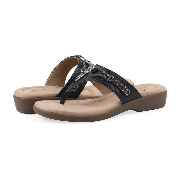 Angle view of a pair of navy thong sandals with silver bead embellishments and a tan sole