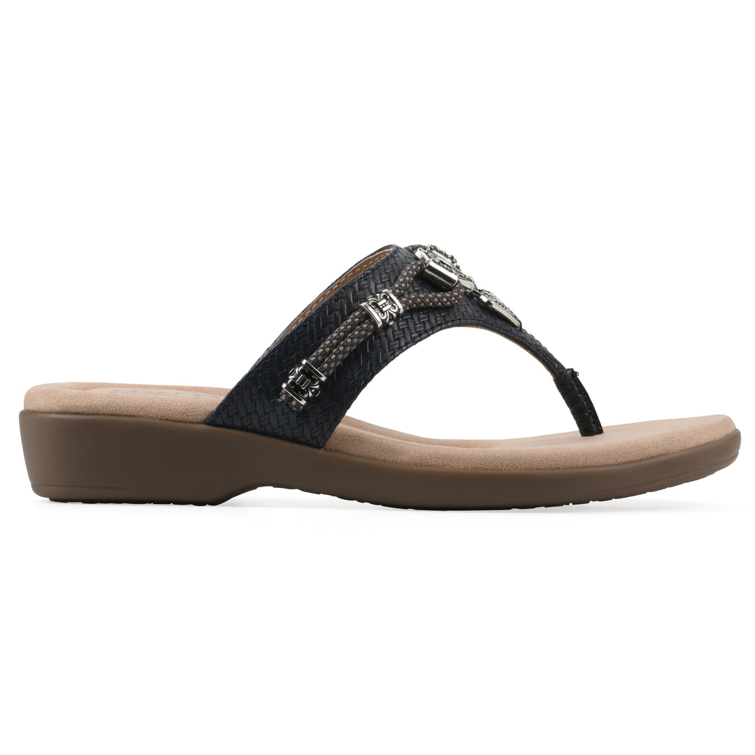 Side view of navy thong sandal with silver bead embellishments and a tan sole