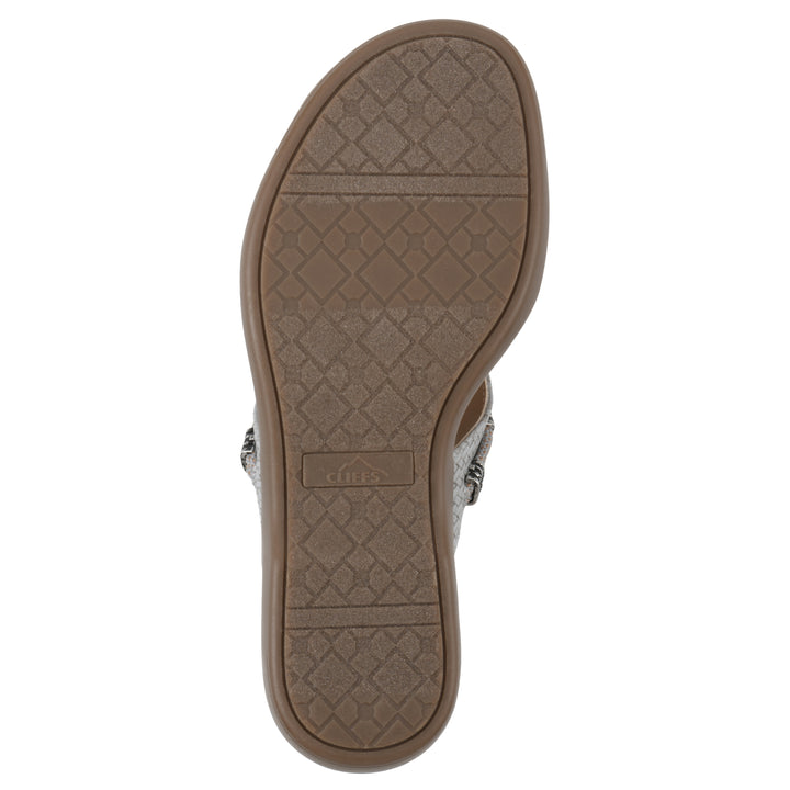 Sole view of a slate thong sandal with silver bead embellishments and a tan sole