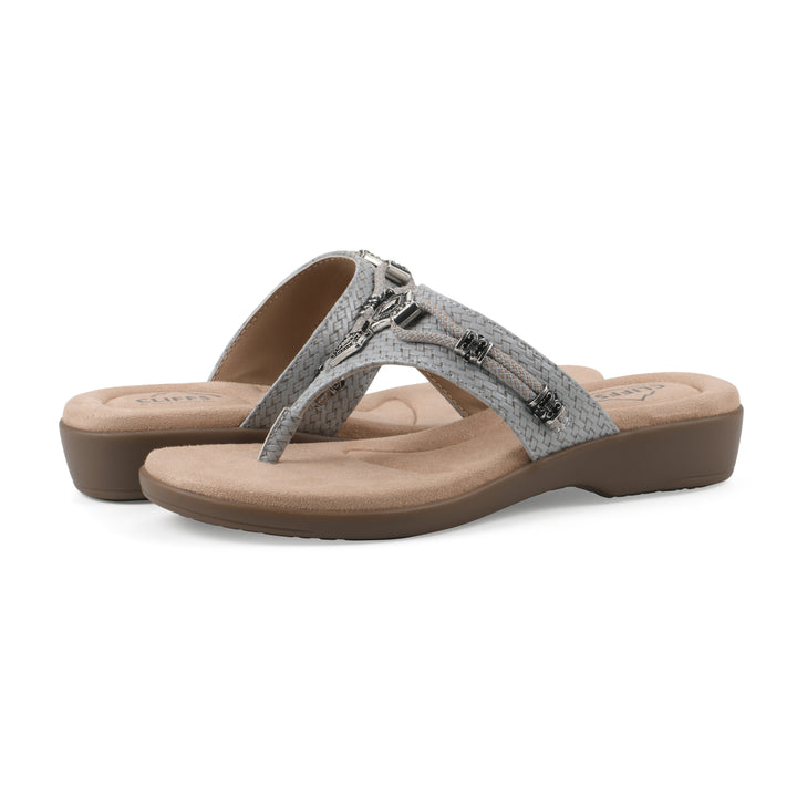 Angle view of a pair of slate thong sandals with silver bead embellishments and a tan sole