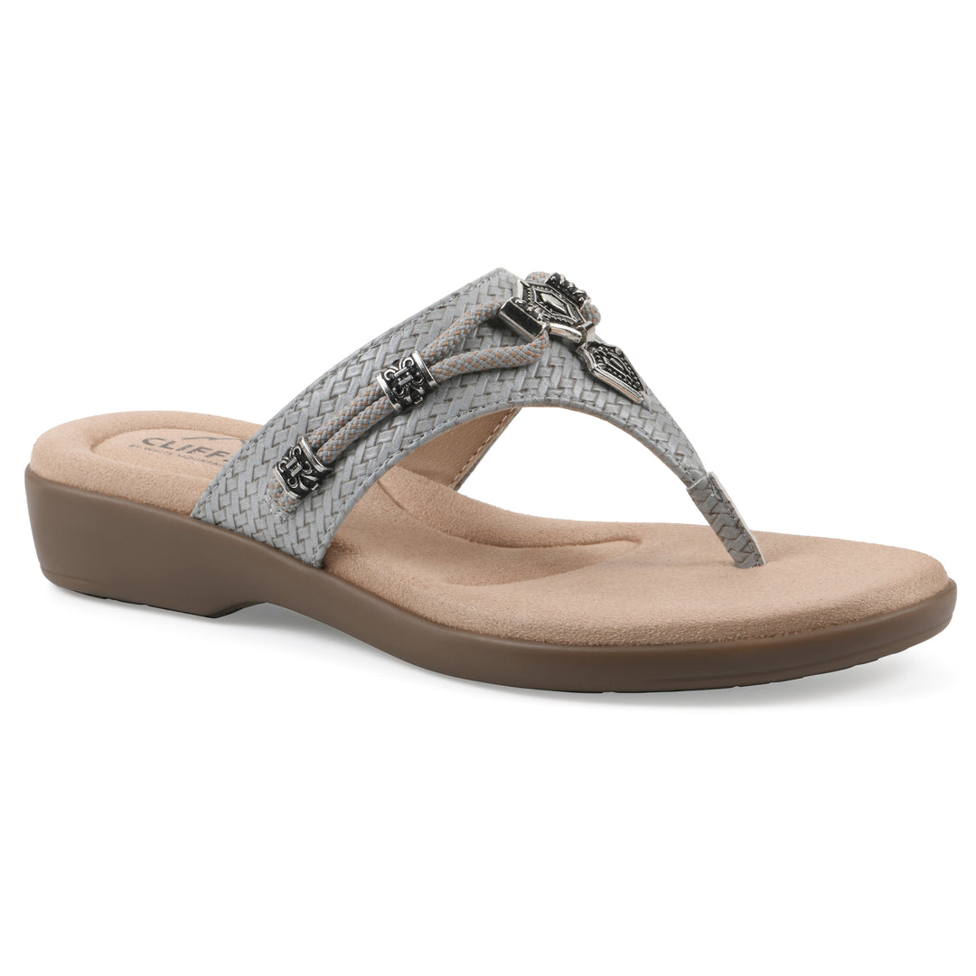 Angle view of a slate thong sandal with silver bead embellishments and a tan sole