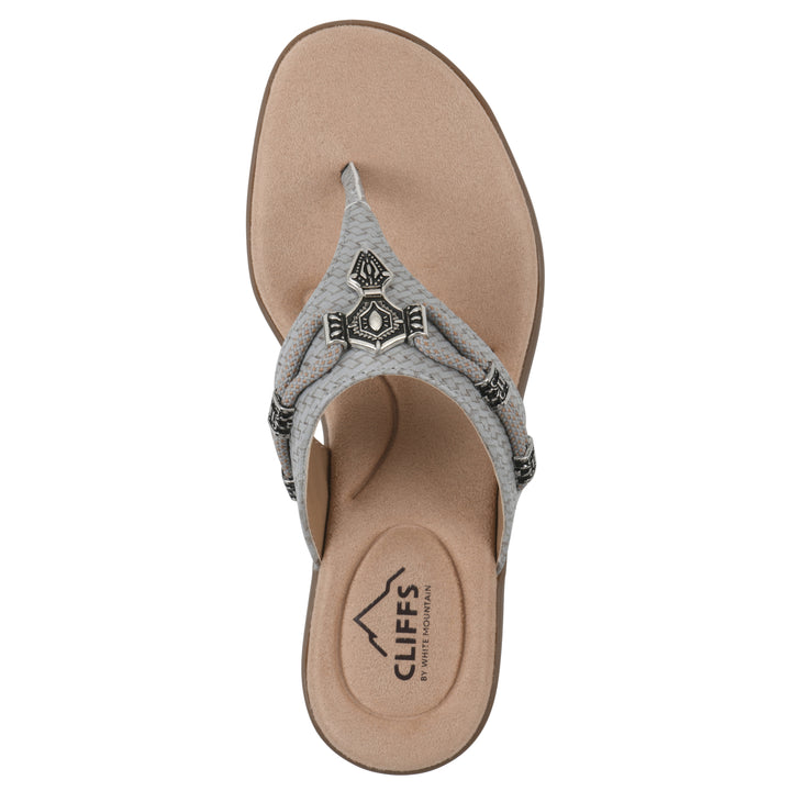 Top view of a slate thong sandal with silver bead embellishments and a tan sole