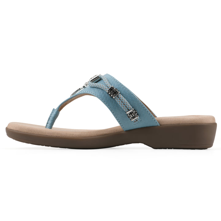 Side view of light blue thong sandal with silver bead embellishments and a tan sole