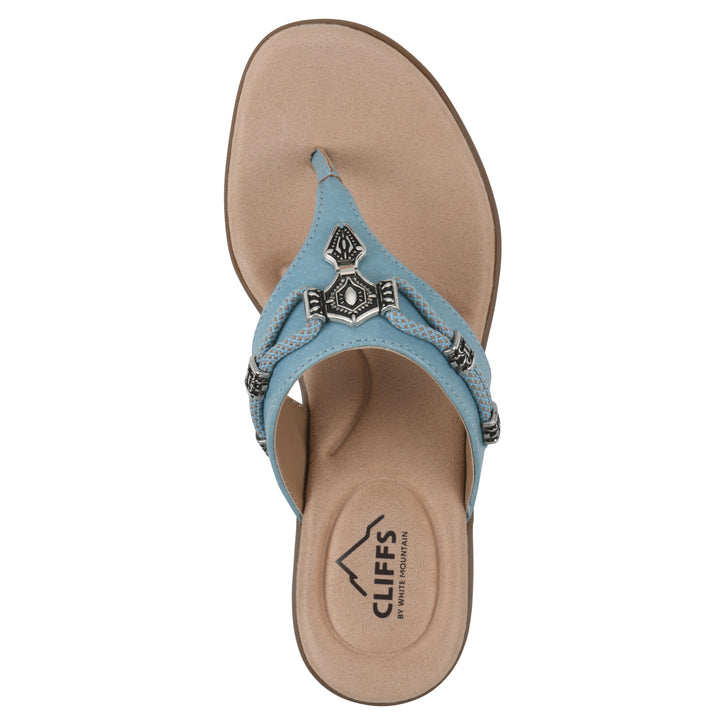 Top view of light blue thong sandal with silver bead embellishments and a tan sole