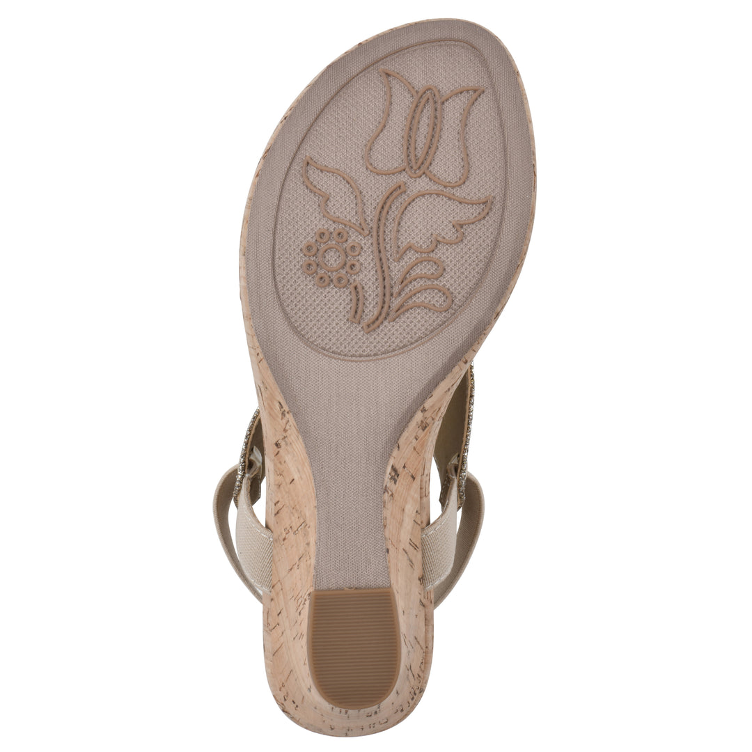Sole view of a light gold fabric thong wedge sandal with cork heel, and elastic ankle strap