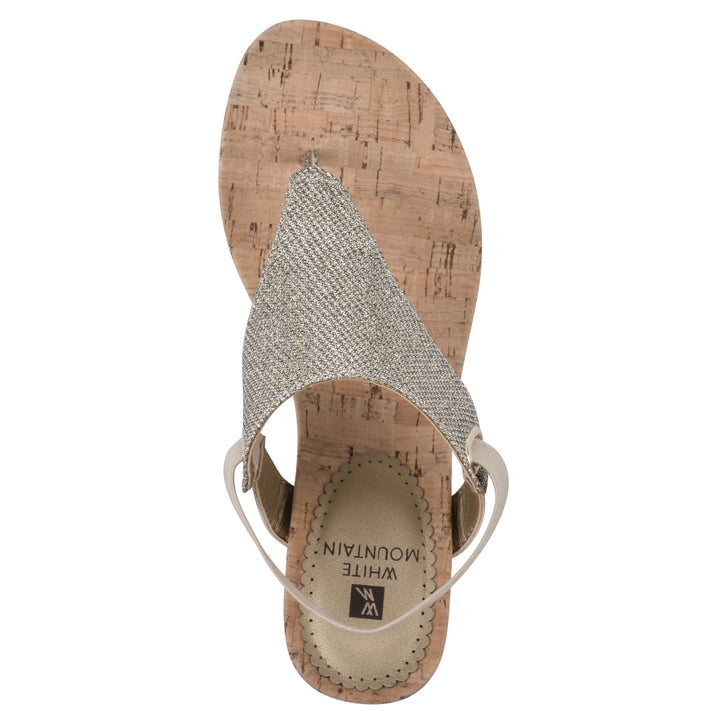 Top view of a light gold fabric thong wedge sandal with cork heel, and elastic ankle strap