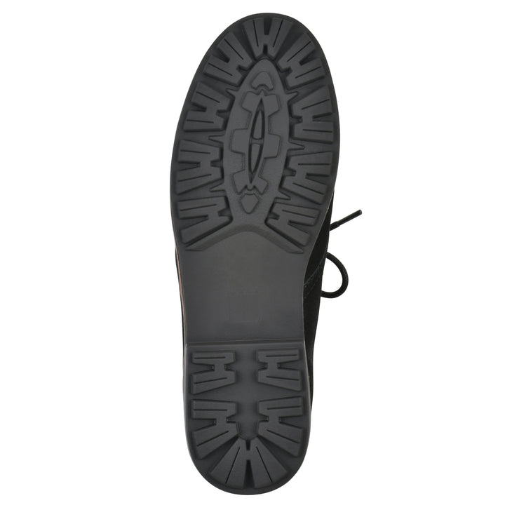 Sole view of a black suede bootie with lace-up closure and a low black heel 