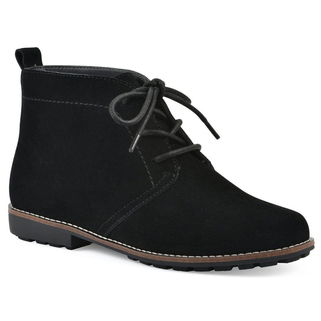 Angle view of a black suede bootie with lace-up closure and a low black heel 

