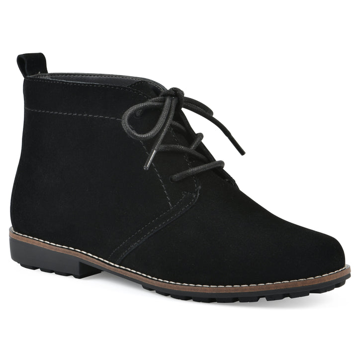 Angle view of a black suede bootie with lace-up closure and a low black heel 

