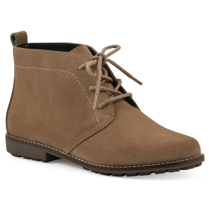 Angle view of a tan suede bootie with lace-up closure and a low heel 