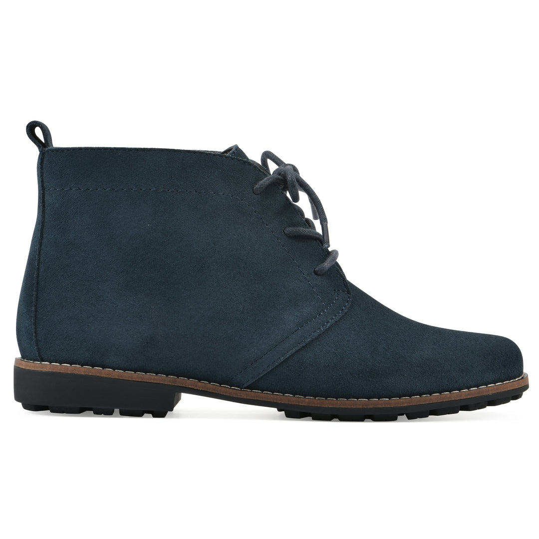 Side view of a Navy suede bootie with lace-up closure and a low heel 