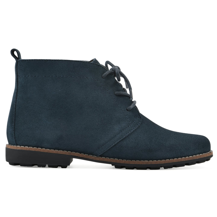 Side view of a Navy suede bootie with lace-up closure and a low heel 