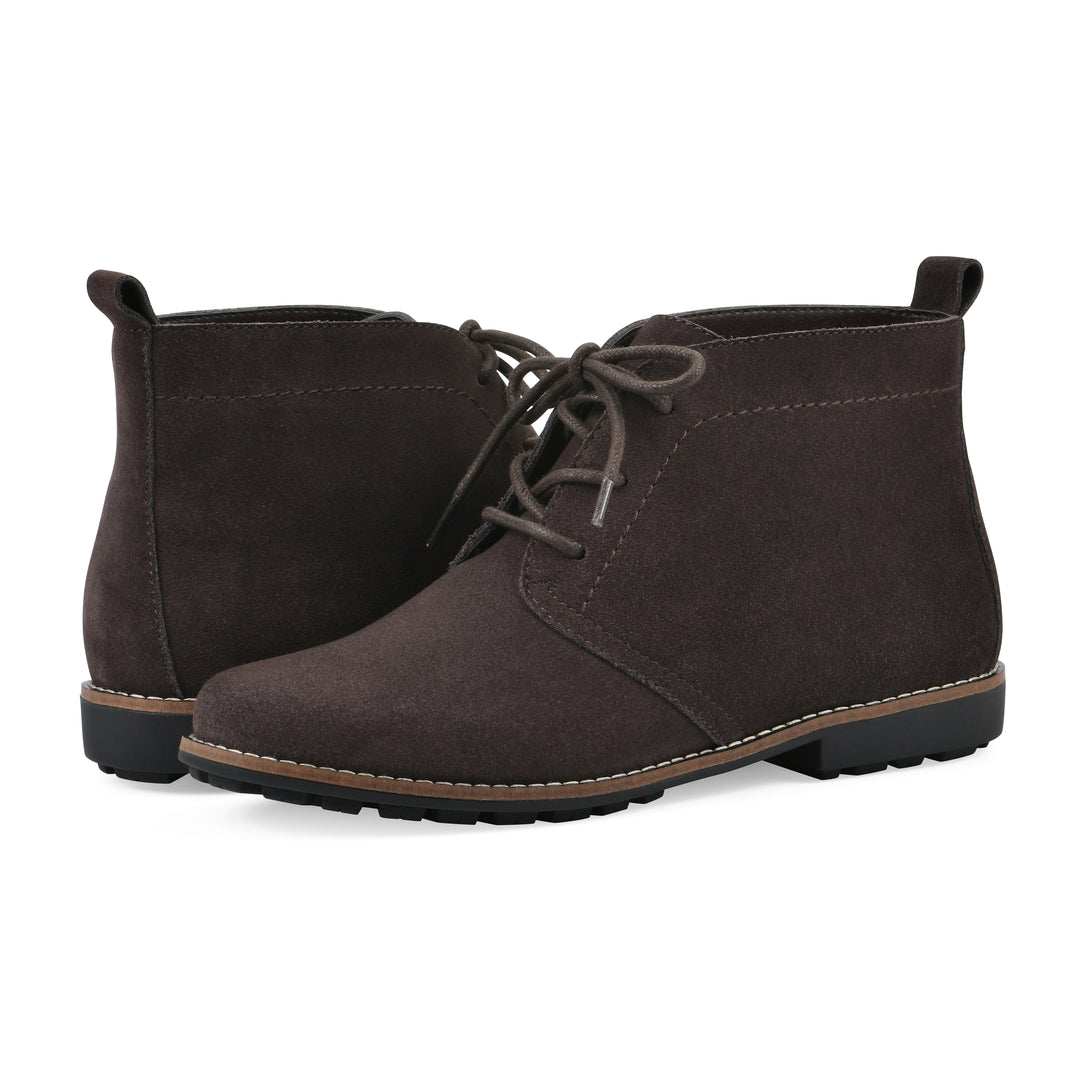 Angle view of a pair of deep brown suede booties with lace-up closure and a low heel 