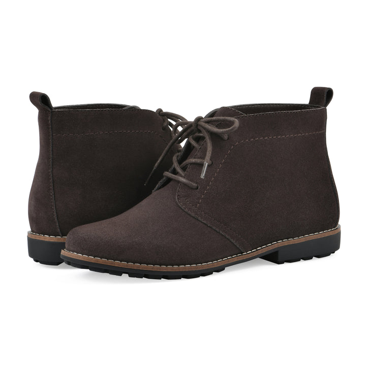 Angle view of a pair of deep brown suede booties with lace-up closure and a low heel 