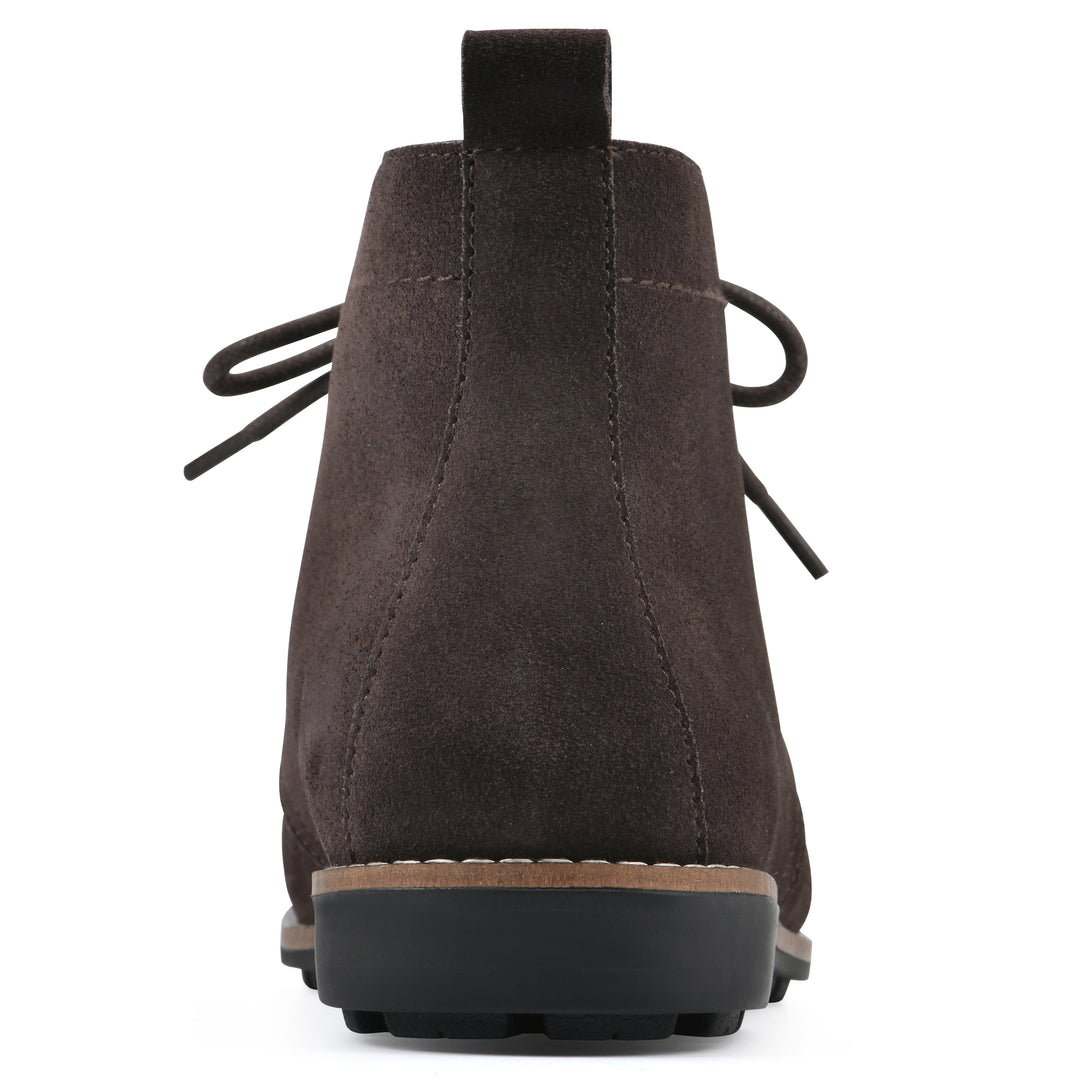 Rear view of a deep brown suede bootie with lace-up closure and a low heel 
