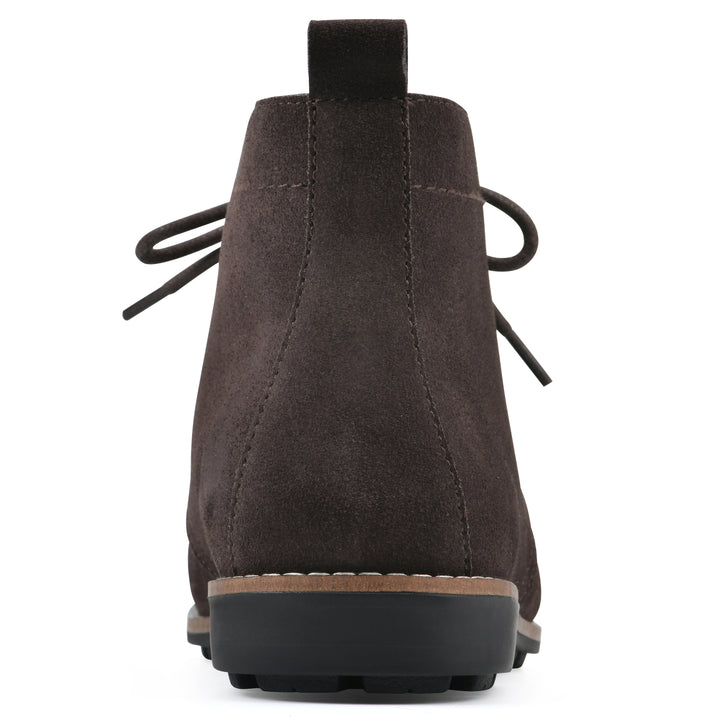 Rear view of a deep brown suede bootie with lace-up closure and a low heel 