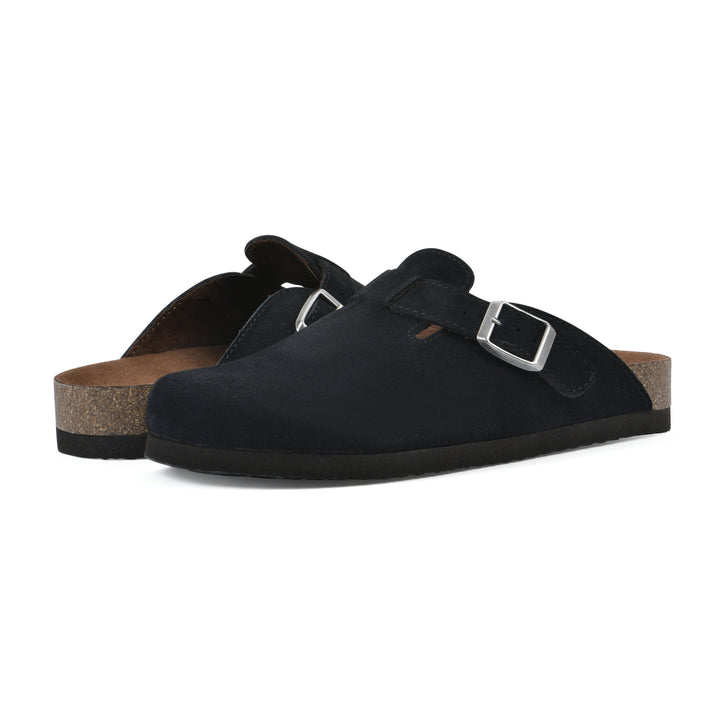 Angle view of a pair of black suede clogs with metal buckle on an adjustable strap, and a brown sole with black bottom