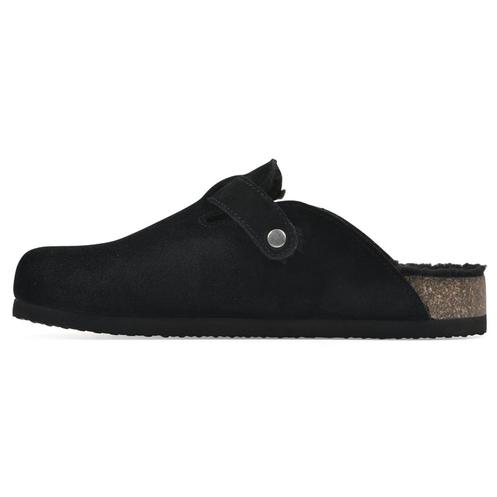 Side view of a black suede clog with black faux shearling lining, a metal buckle on an adjustable strap, and a brown sole with black bottom