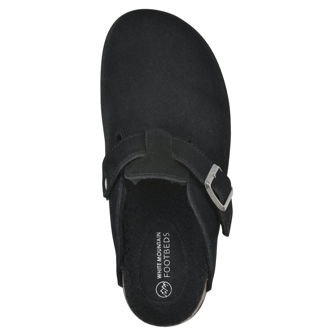 Top view of a black suede clog with black faux shearling lining, a metal buckle on an adjustable strap, and a brown sole with black bottom