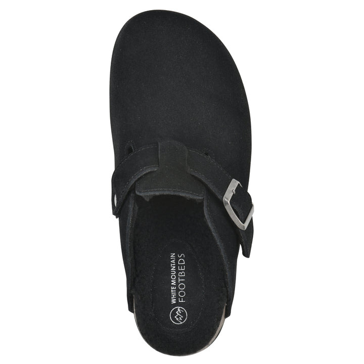 Top view of a black suede clog with black faux shearling lining, a metal buckle on an adjustable strap, and a brown sole with black bottom