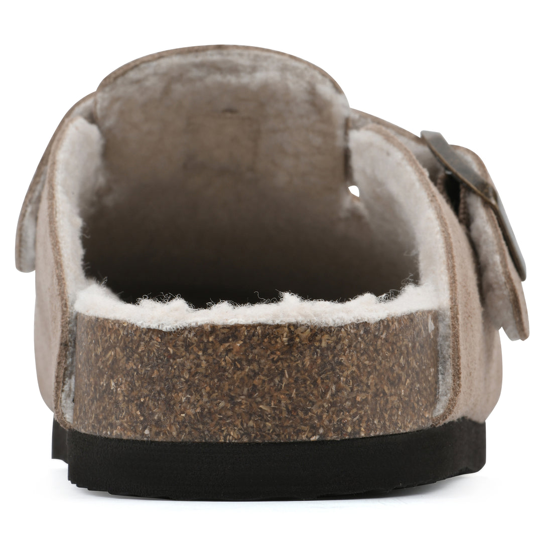 Rear view of a taupe suede clog with white faux shearling lining, a metal buckle on an adjustable strap, and a brown sole with black bottom