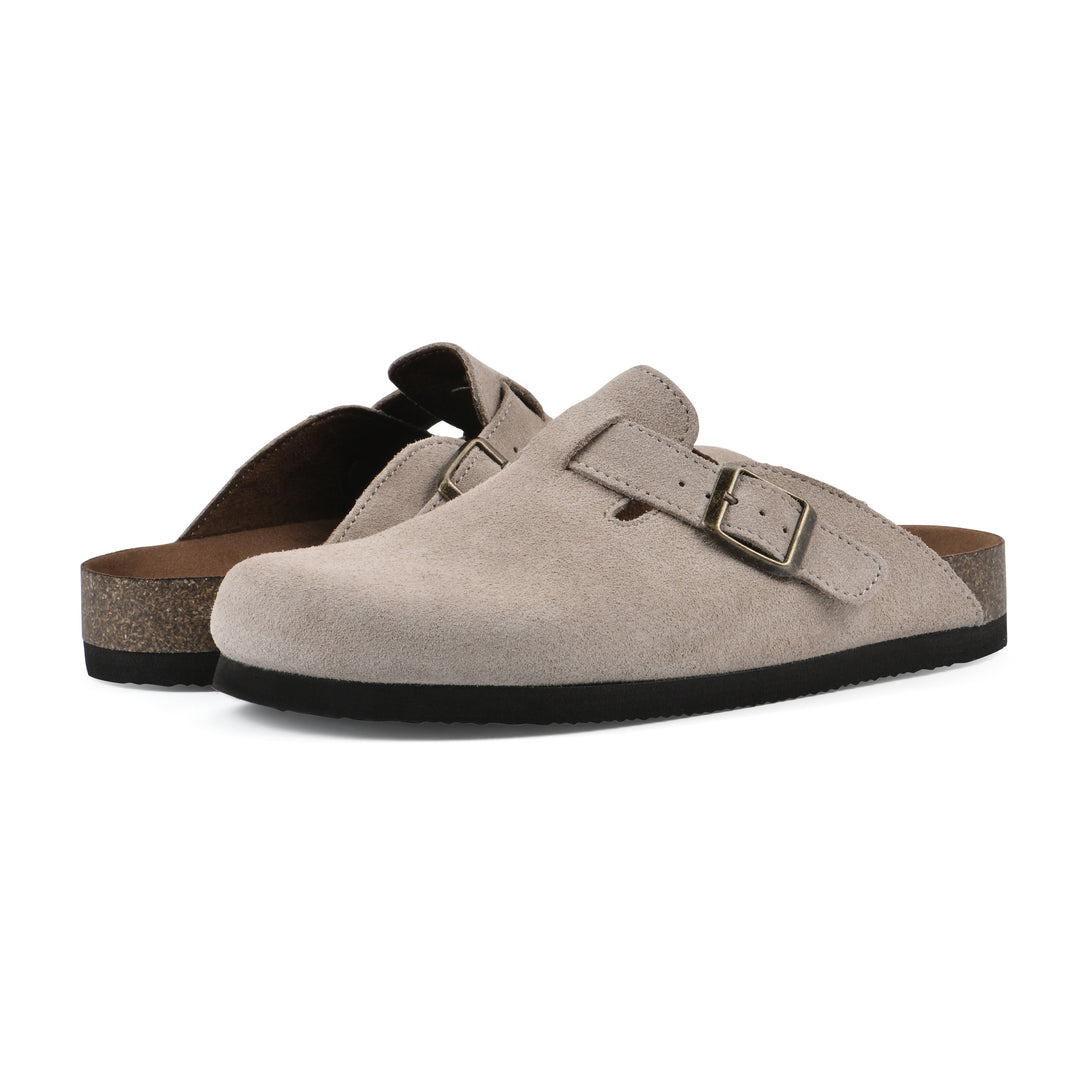 Angle view of a pair of taupe suede clogs with metal buckle on an adjustable strap, and a brown sole with black bottom