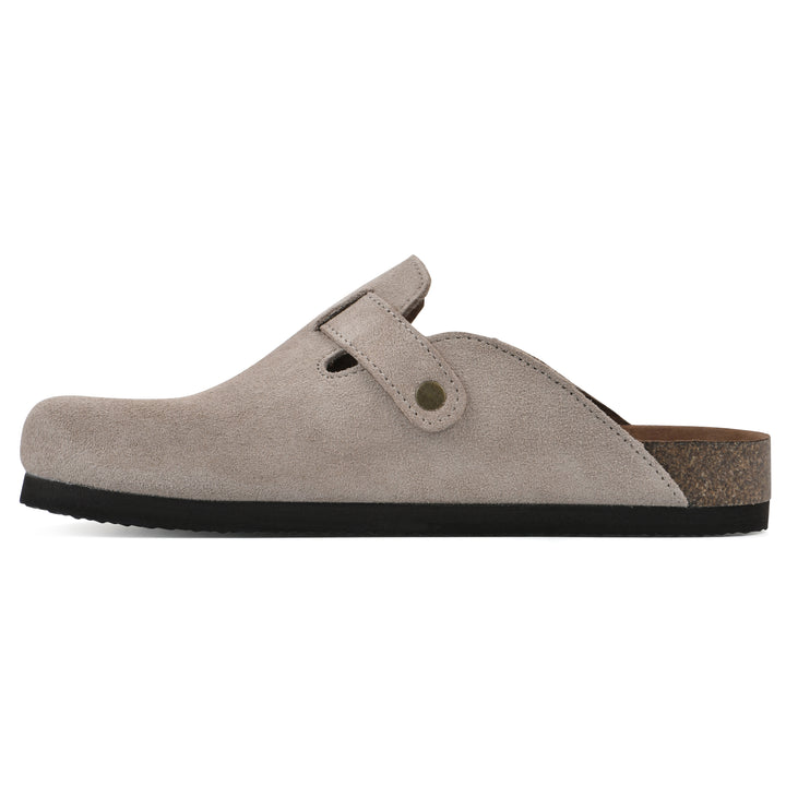 Side view of a taupe suede clog with metal buckle on an adjustable strap, and a brown sole with black bottom