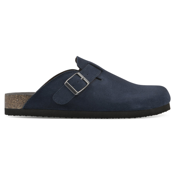 Side view of a navy suede clog with metal buckle on an adjustable strap, and a brown sole with black bottom