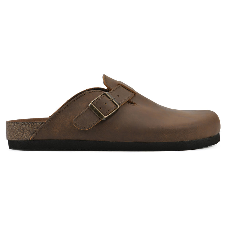 Side view of a whiskey leather clog with metal buckle on an adjustable strap, and a brown sole with black bottom