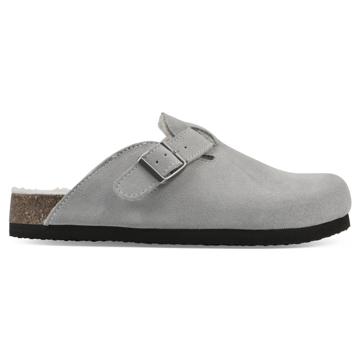 Side view of a light grey suede clog with white faux shearling lining, a metal buckle on an adjustable strap, and a brown sole with black bottom