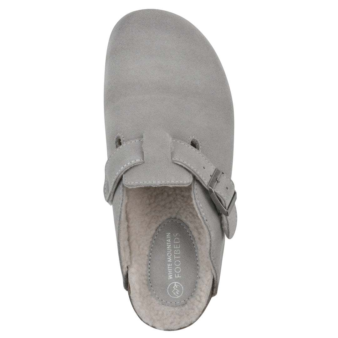 Top view of a light grey suede clog with white faux shearling lining, a metal buckle on an adjustable strap, and a brown sole with black bottom