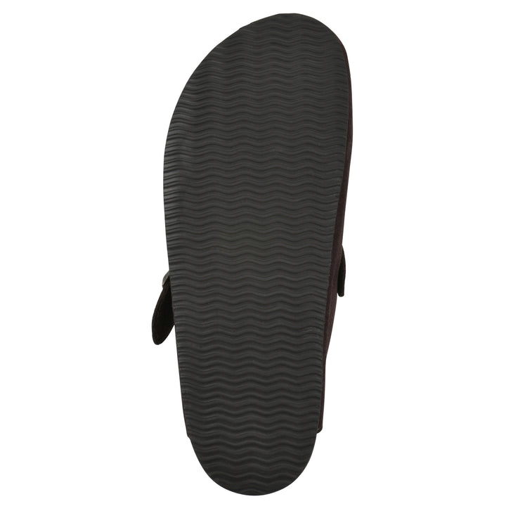 Sole view of a brown suede clog with a metal buckle on an adjustable strap, and a brown sole with black patterned bottom