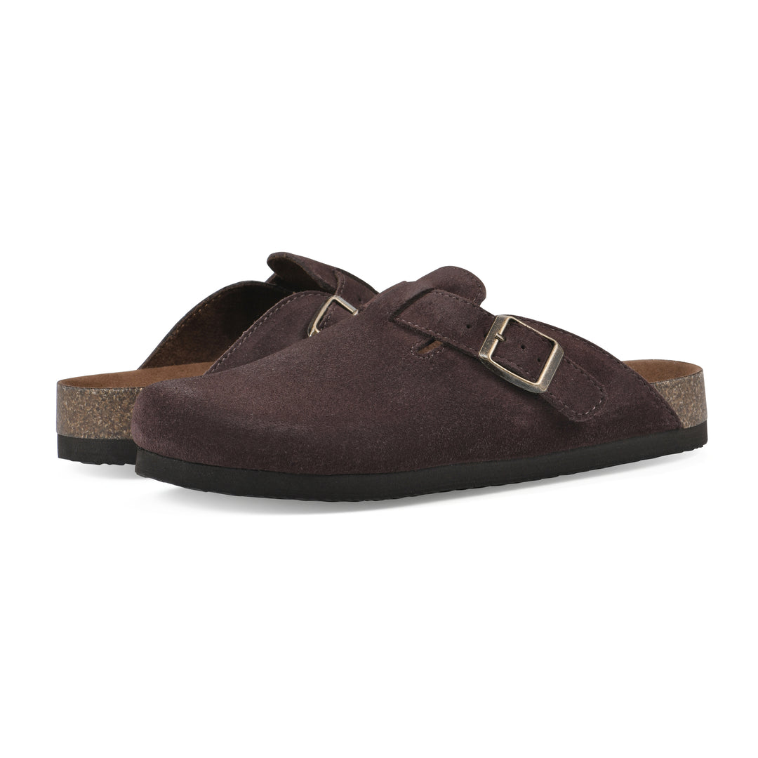 Angle view of a pair of brown suede clogs with a metal buckle on an adjustable strap, and a brown sole with black bottom