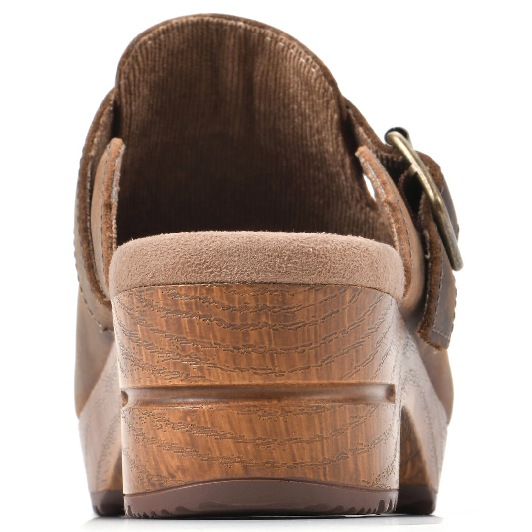Rear view of a backless brown leather clog with adjustable buckle and wood style heel