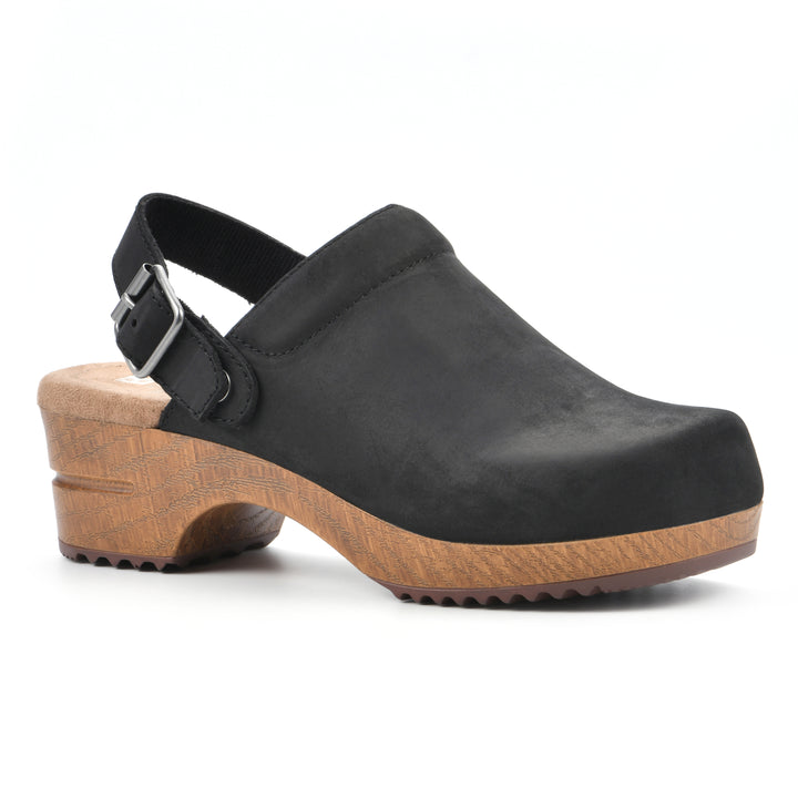 Angle view of a backless black leather clog with adjustable back strap and wood style heel