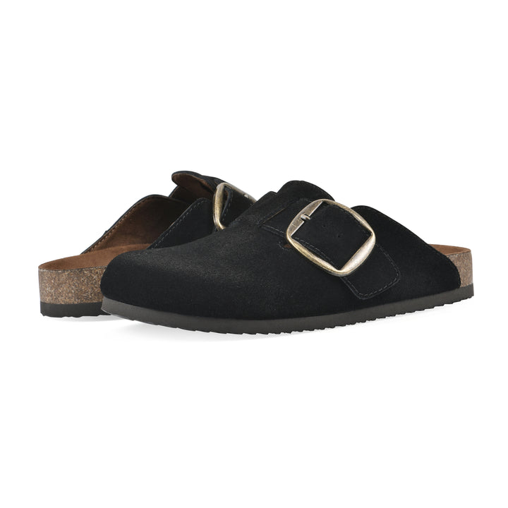 Angle view of a pair of black suede backless clogs with large adjustable buckle and a black sole