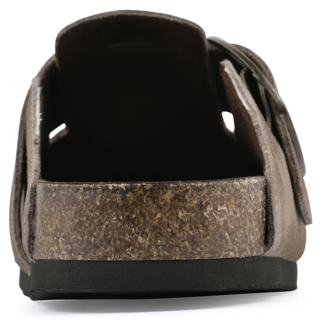 Rear view of a taupe suede backless clog with large adjustable buckle and a black sole