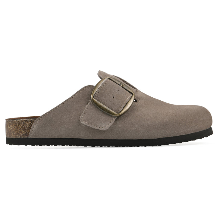 Side view of a taupe suede backless clog with large adjustable buckle and a black sole