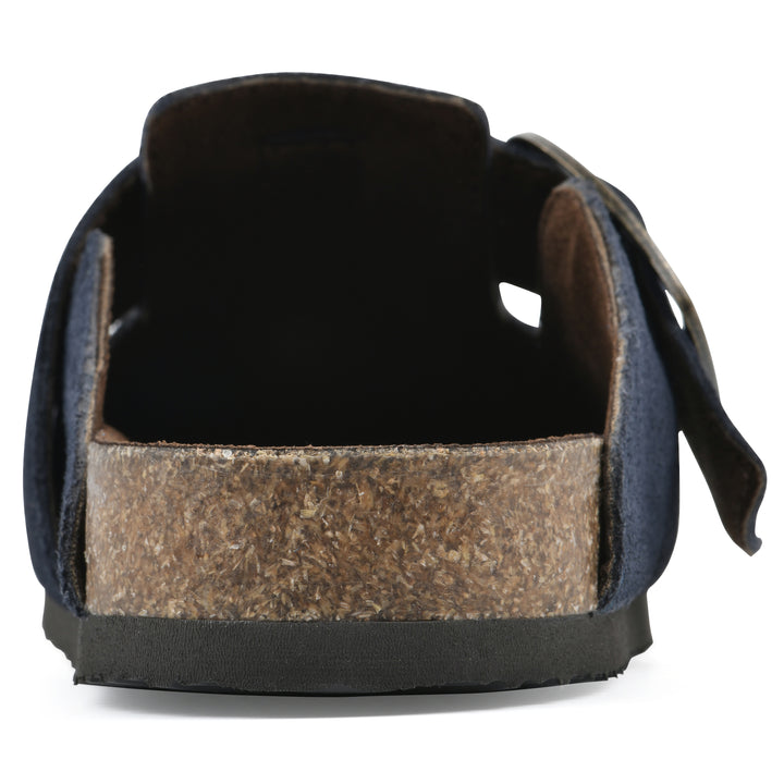 Rear view of a navy suede backless clog with large adjustable buckle and a black sole