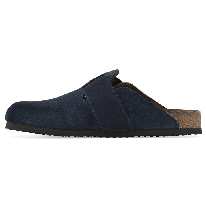 Side view of a navy suede backless clog with large adjustable buckle and a black sole